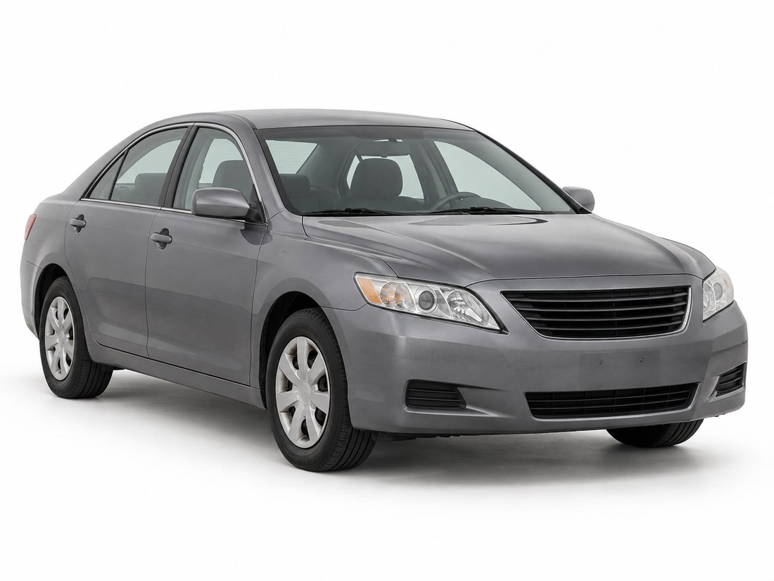 An unbadged grey four-door sedan seen from the front quarter on a white background
